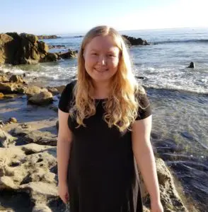 Maddie Ocean_ a child sorting objects by size, enhancing cognitive and motor development