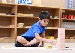 3K4A4232 students learning about world cultures using Montessori cultural materials