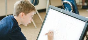 students learning to read using Montessori movable alphabet materials