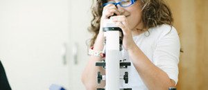 a child engaged in a Montessori botany activity, learning about plant parts